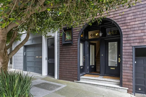 a view of a wooden door of the house