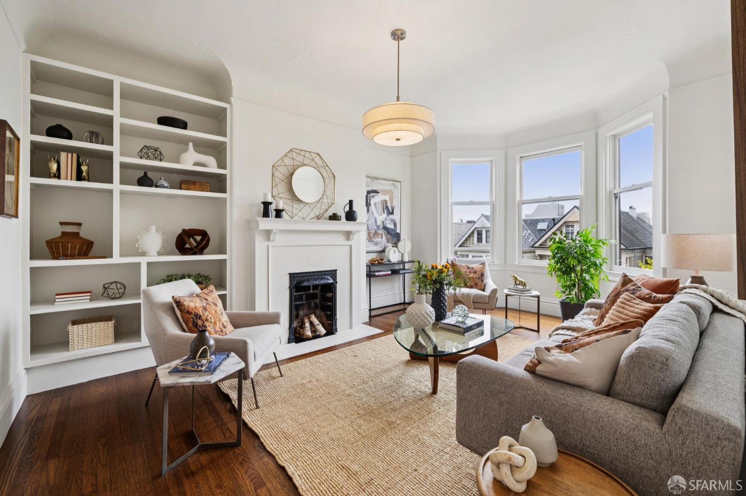 440 Laurel Street San Francisco, CA 94118 - Photo 4 of 24 a living room with furniture a fireplace and a window