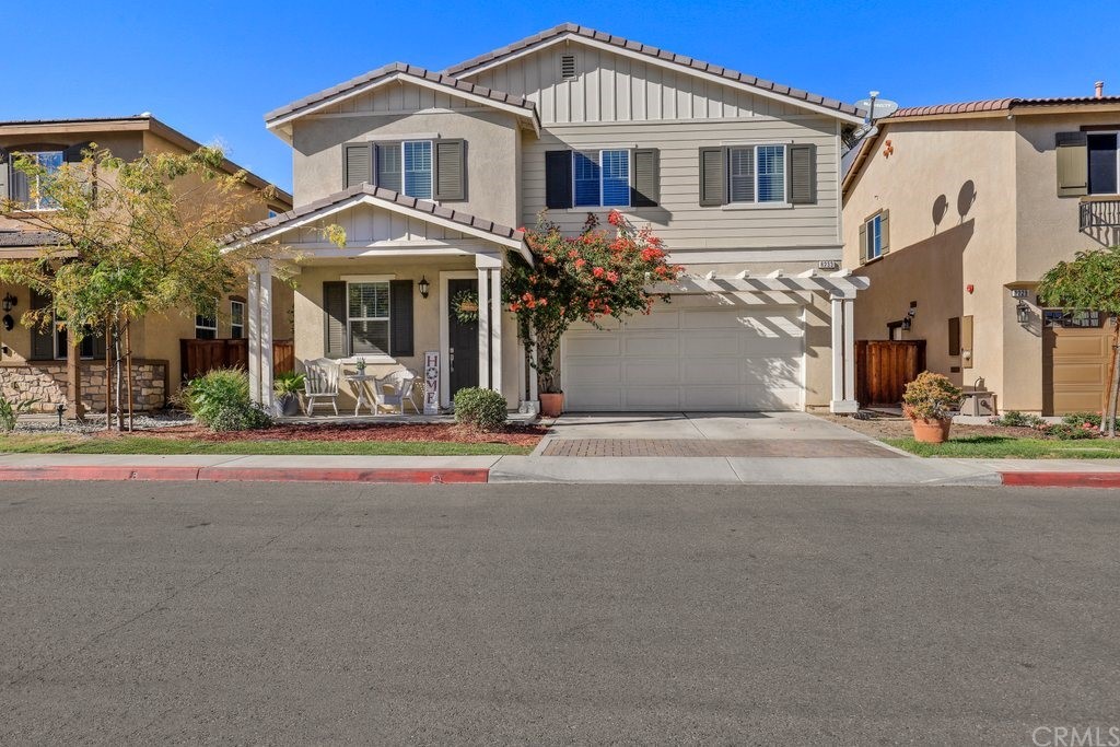 8233 Casa Colima Way Riverside, CA 92504 - Photo 1 of 1 a front view of a house with a yard