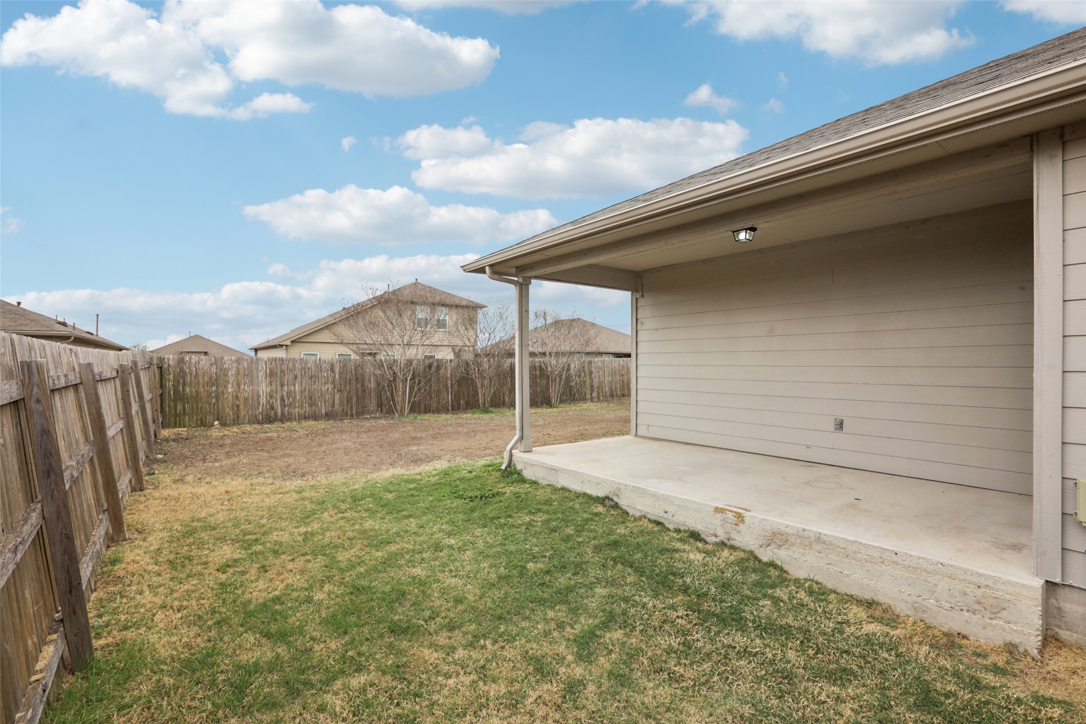 221 Alpha Kyle, TX 78640 - Photo 28 of 37 Fenced backyard featuring a patio