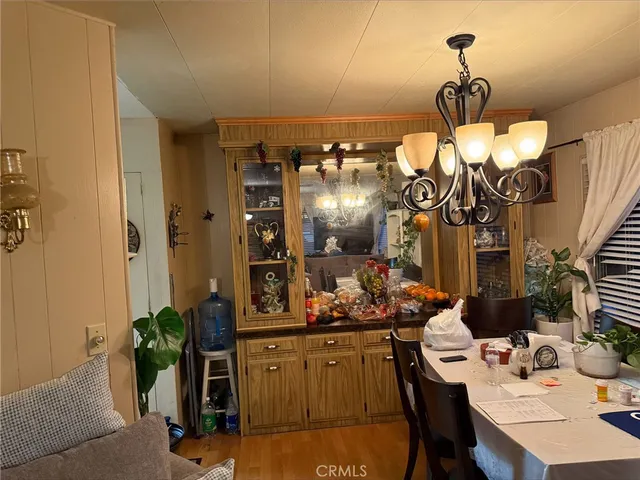 a kitchen with a table and chairs in it