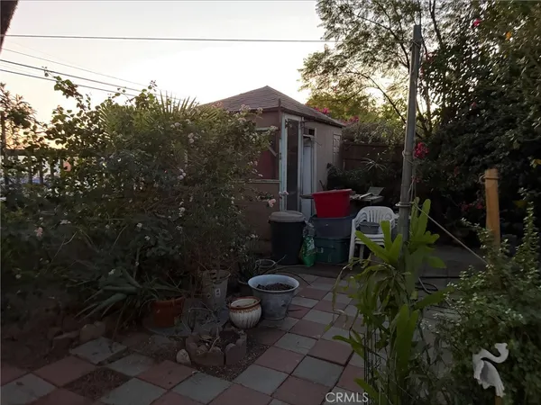 a backyard of a house with outdoor seating