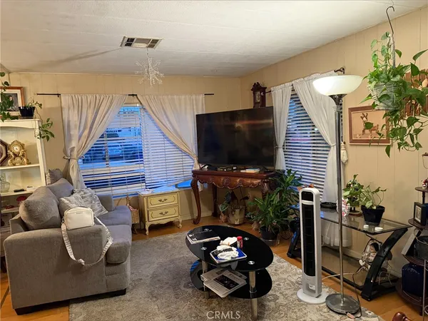 a room with furniture and a flat screen tv