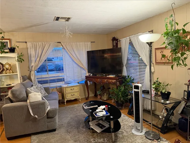 a room with furniture and a flat screen tv