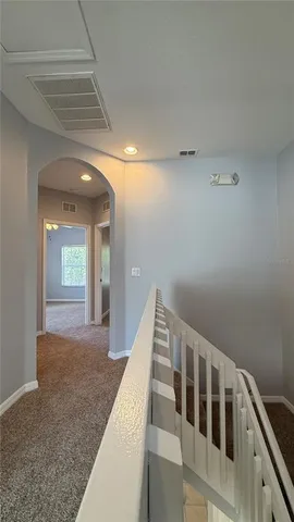 a view of a hallway with staircase