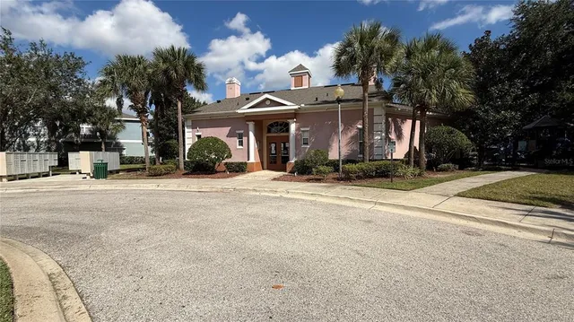 a view of a street with a building in the background