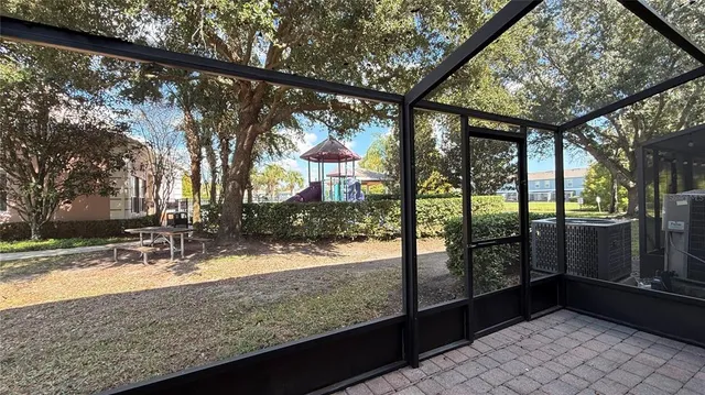 a view of swimming pool with a patio