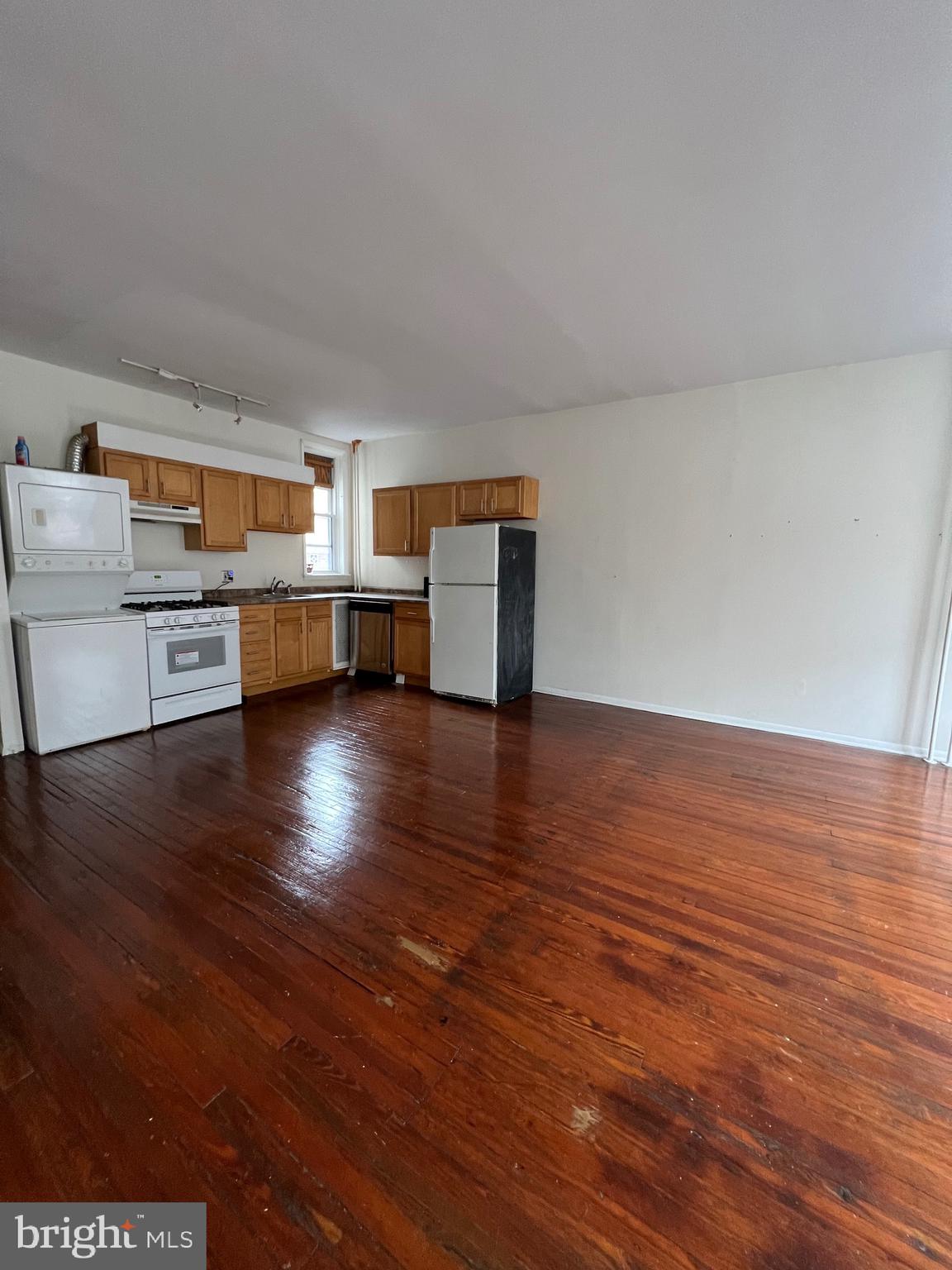 721 Bainbridge Street, Unit 2 Philadelphia, PA 19147 - Photo 2 of 8 a room with furniture and wooden floor