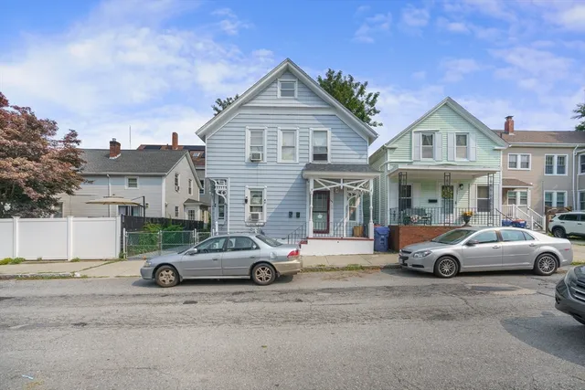 a car parked in front of a house