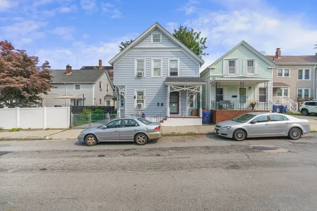 a view of a car parked in front of a house