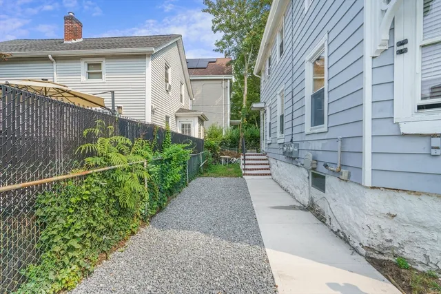 a view of a pathway with a house