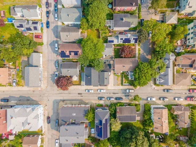 an aerial view of houses with outdoor space