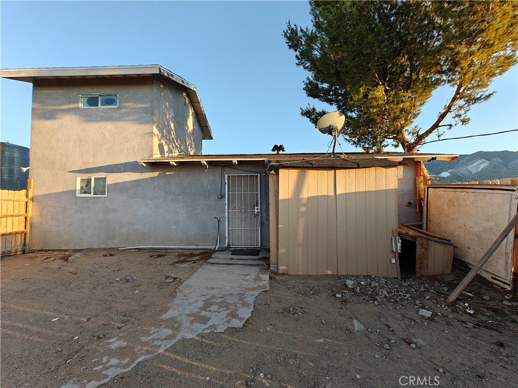 31576 Emerald Road Lucerne Valley, CA 92356 - Photo 18 of 51 a view of a house with a tree