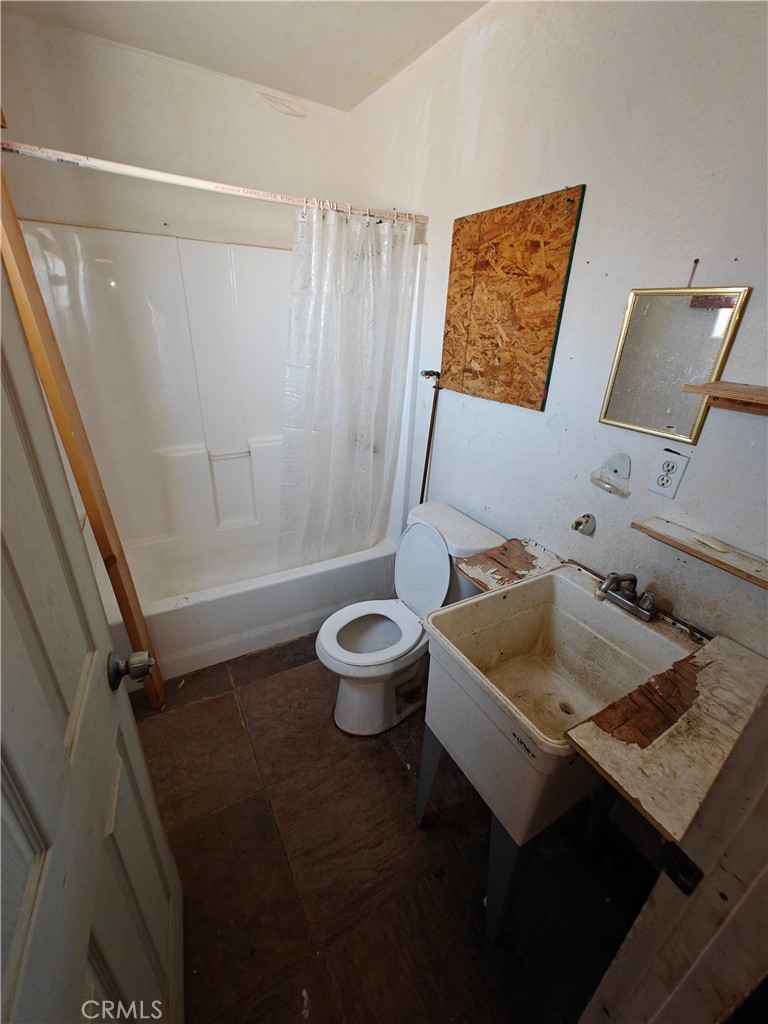 31576 Emerald Road Lucerne Valley, CA 92356 - Photo 22 of 51 a bathroom with a sink and a mirror