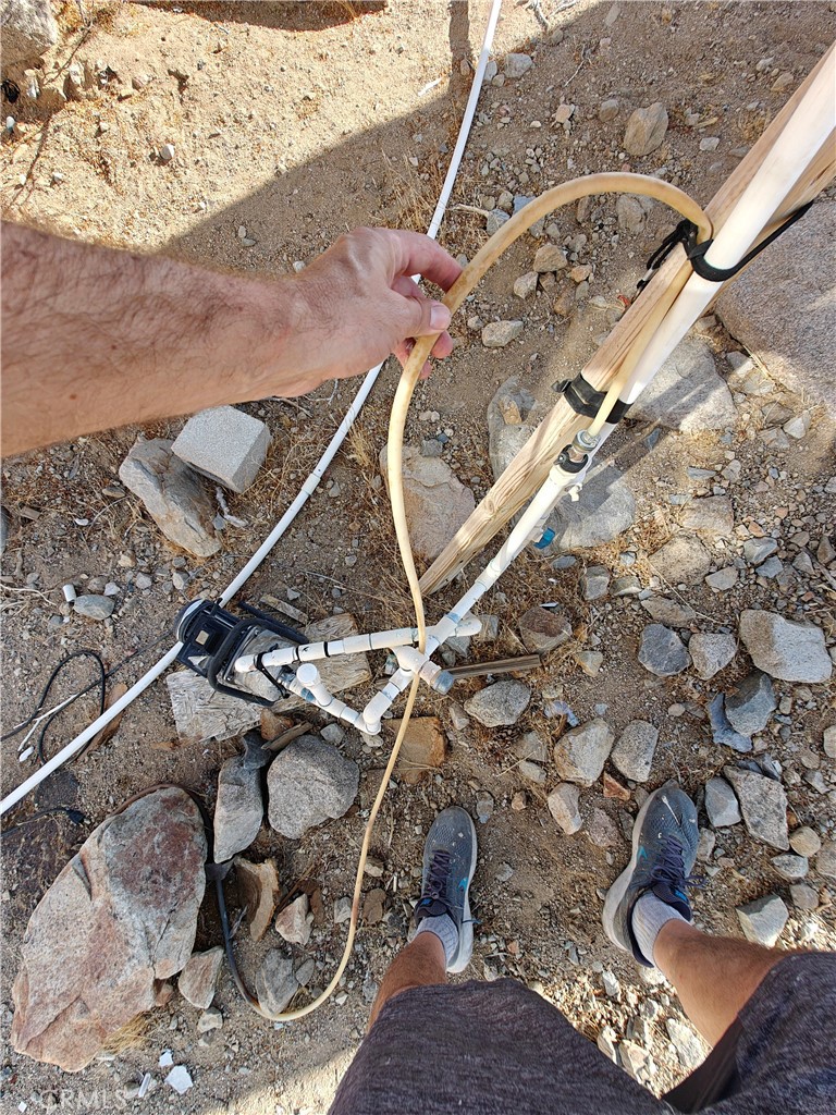 31576 Emerald Road Lucerne Valley, CA 92356 - Photo 47 of 51 a room with water heater and wooden floor