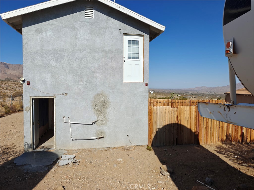 31576 Emerald Road Lucerne Valley, CA 92356 - Photo 51 of 51 a front view of a house with a yard