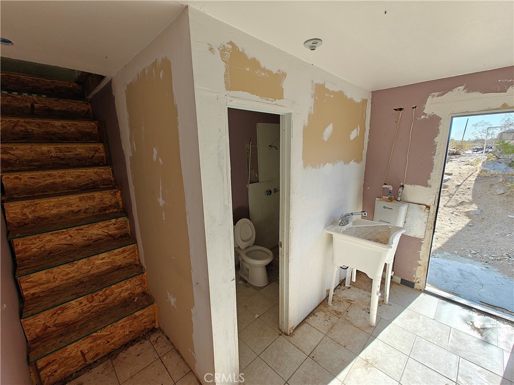 31576 Emerald Road Lucerne Valley, CA 92356 - Photo 10 of 51 a view of a hallway with seating area