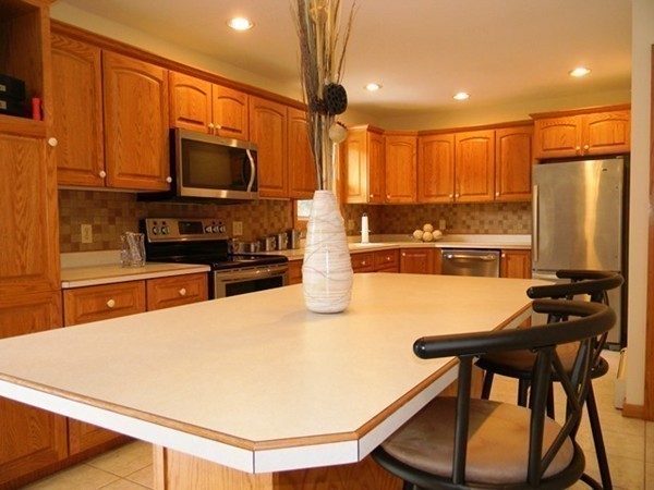185 Athol Road Phillipston, MA 01331 - Photo 5 of 29 a kitchen with stainless steel appliances wooden floor and a refrigerator