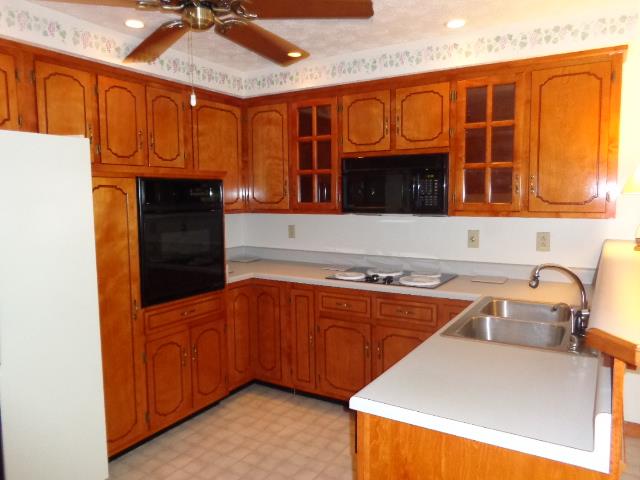 2434 Toler Road Woodlawn, TN 37191 - Photo 11 of 20 Sellers designed kitchen area. Cabinets are in EXCELLENT CONDITION. Sellers were meticulous with the care of this home. Sellers have had Hvac inspected and cleaned twice a year and home has current pest contract.