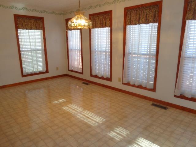 2434 Toler Road Woodlawn, TN 37191 - Photo 13 of 20 Look at all the windows, tons of natural light and a view of the back yard. Plantation blinds remain with home.