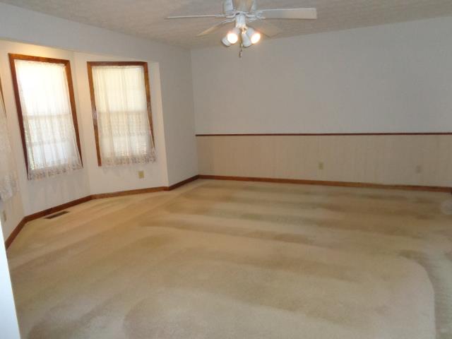 2434 Toler Road Woodlawn, TN 37191 - Photo 15 of 20 Master bed room with bay window, ceiling fan and walk in closets. SPACIOUS. NO PART OF THIS HOME HAS WALL PAPER!!! Everything is stenciled on.