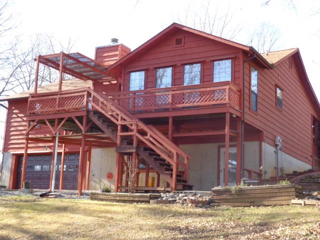 2434 Toler Road Woodlawn, TN 37191 - Photo 3 of 20 Back of home overlooking 3.44 acres. Bring your horse, chickens or goats! NO pigs please. Gently sloped lot, wooded plus pasture area.