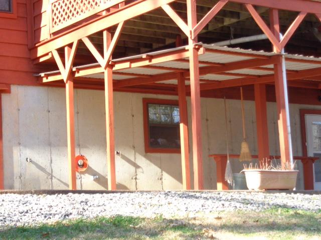 2434 Toler Road Woodlawn, TN 37191 - Photo 4 of 20 Poured concrete walls. No concrete block foundation. Seller had trench dug around house added insulated panels, drainage pipes from the gutters and epoxy. This is one strong and dry basement. Absolutely no smelly basement odors here.