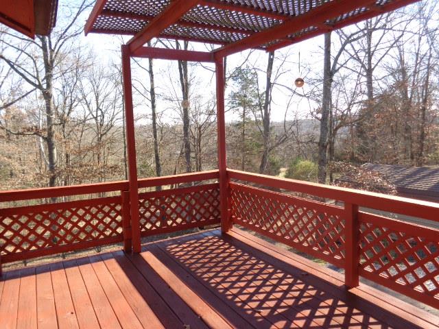 2434 Toler Road Woodlawn, TN 37191 - Photo 5 of 20 Back deck area with view of 3.44 acres plus two large wooden storage buildings and one metal building and carport. Home also has 2 car garage in the basement with unique features.
