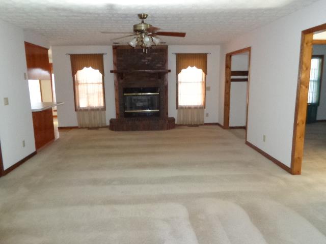 2434 Toler Road Woodlawn, TN 37191 - Photo 8 of 20 Living room with wood burning fire place, currently converted to gas. ( easy to convert back to wood)