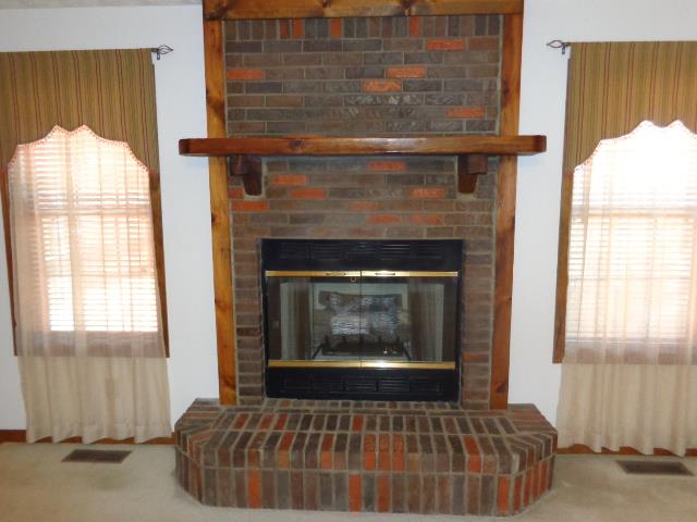 2434 Toler Road Woodlawn, TN 37191 - Photo 9 of 20 Awesome fireplace off to the right side is area for entertainment center and will allow for a LARGE TV.