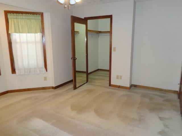 2434 Toler Road Woodlawn, TN 37191 - Photo 10 of 20 Living room, facing towards the front door. Home has tons of closets and storage in the basement. All curtains and items in home convey.