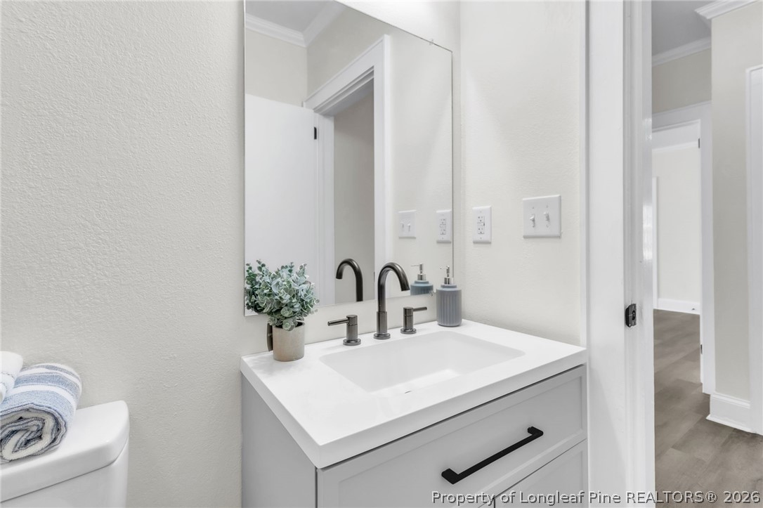 203 Trinity Street Fairmont, NC 28340 - Photo 21 of 34 a bathroom with a sink and a mirror
