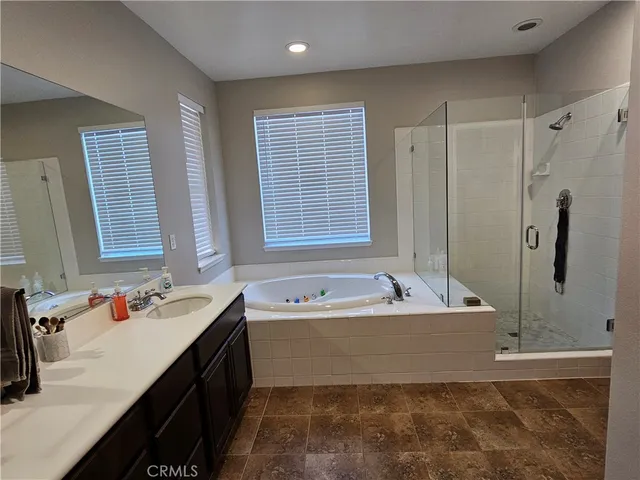 a bath room with a bath tub and a sink