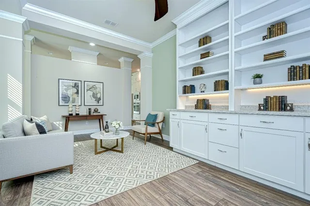 a living room with furniture and a rug