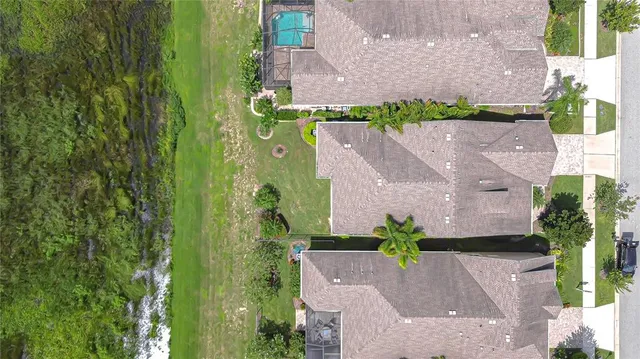 an aerial view of a house with a garden