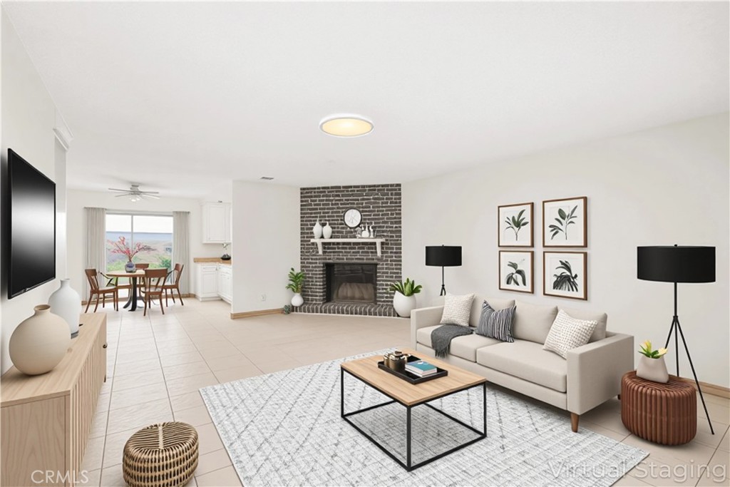 20209 Otoe Road Apple Valley, CA 92307 - Photo 12 of 32 a living room with furniture and a fireplace