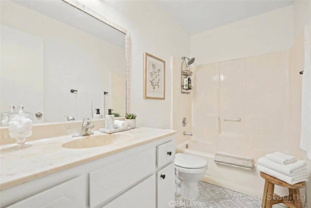 20209 Otoe Road Apple Valley, CA 92307 - Photo 15 of 32 a bathroom with a sink a toilet and shower