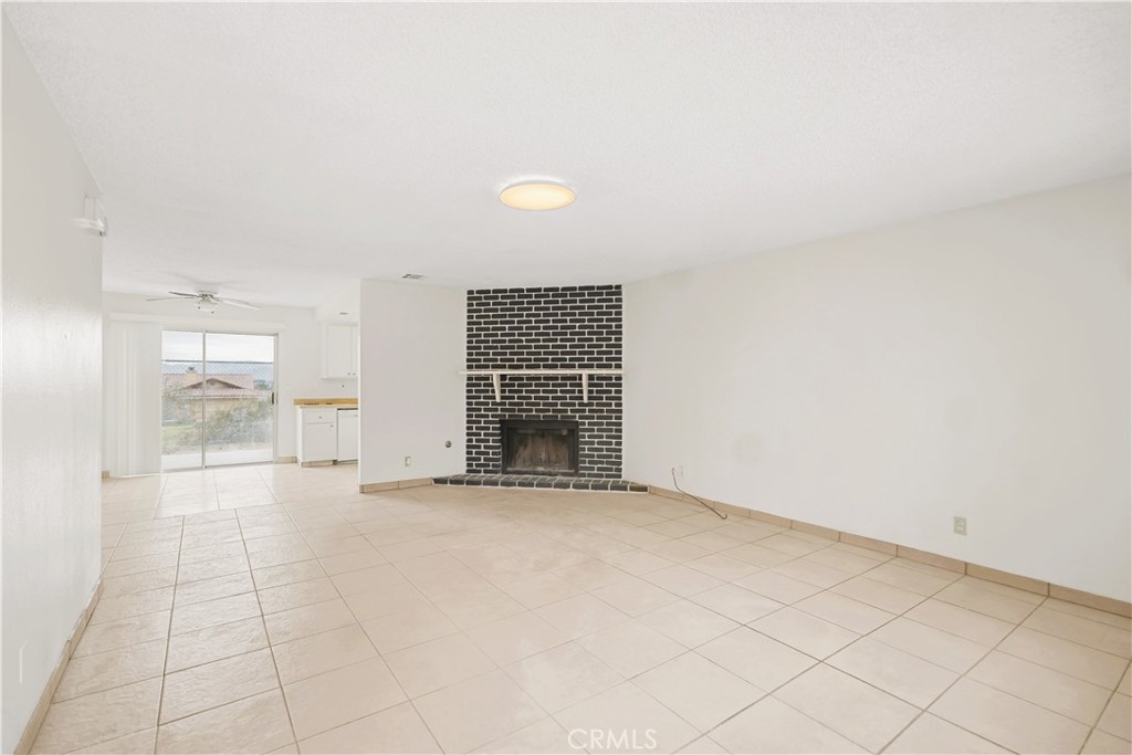 20209 Otoe Road Apple Valley, CA 92307 - Photo 16 of 32 an empty room with fireplace