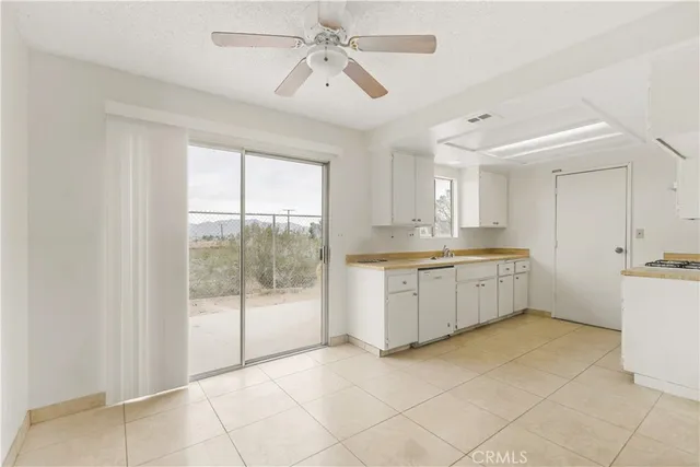 a kitchen with cabinets and appliances