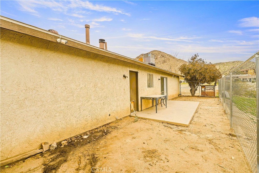 20209 Otoe Road Apple Valley, CA 92307 - Photo 31 of 32 a view of a swimming pool with a lawn chairs