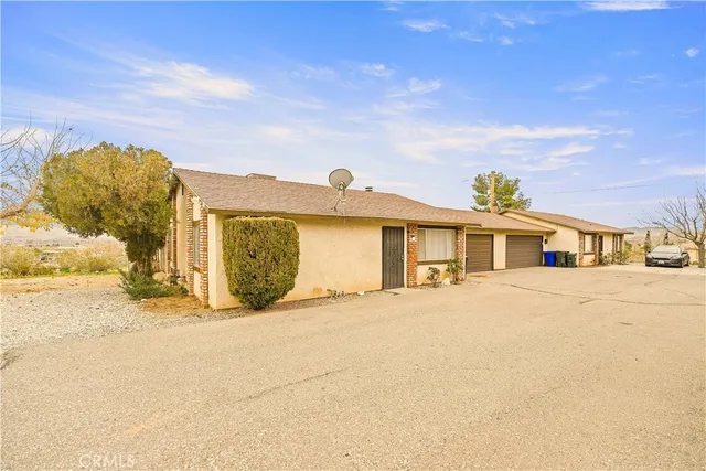 a view of white house with a outdoor space