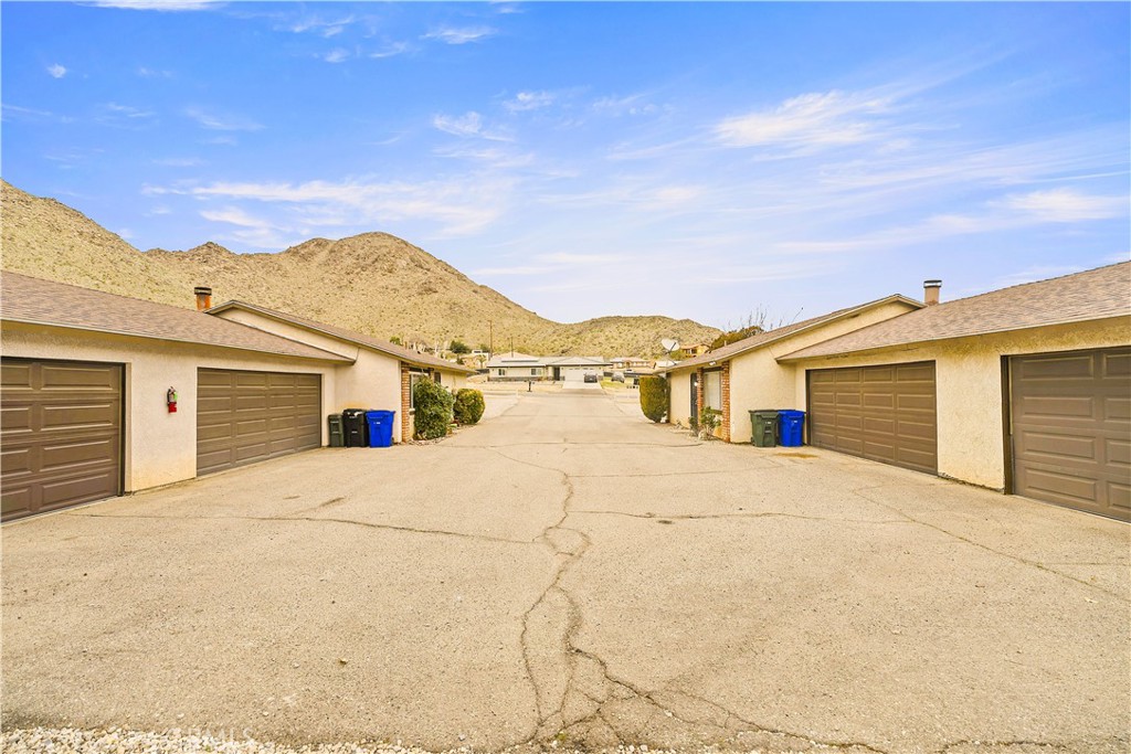 20209 Otoe Road Apple Valley, CA 92307 - Photo 8 of 32 a view of white house with a outdoor space