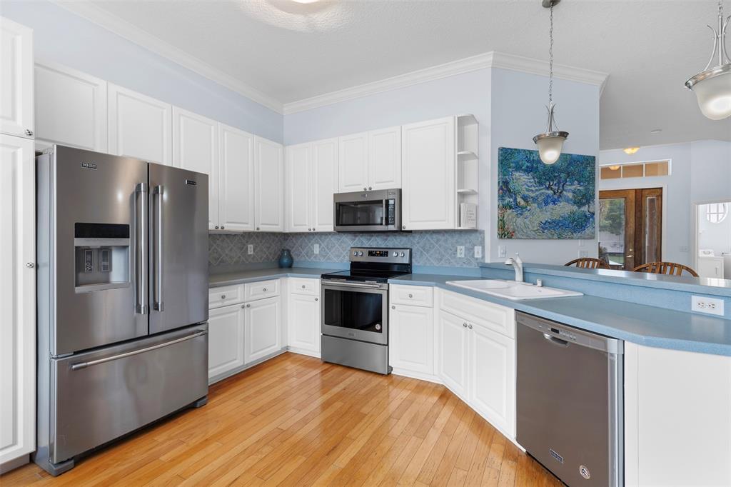 11 Winghaven Lane Fort Pierce, FL 34949 - Photo 11 of 50 a kitchen with a refrigerator stove and sink