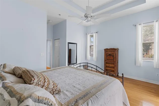 a bathroom with a tub a sink and mirror