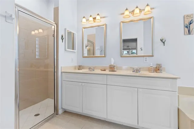 a bedroom with a bed couch and window