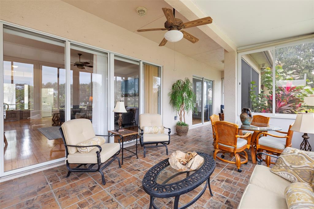 11 Winghaven Lane Fort Pierce, FL 34949 - Photo 25 of 50 a living room with furniture and a floor to ceiling window
