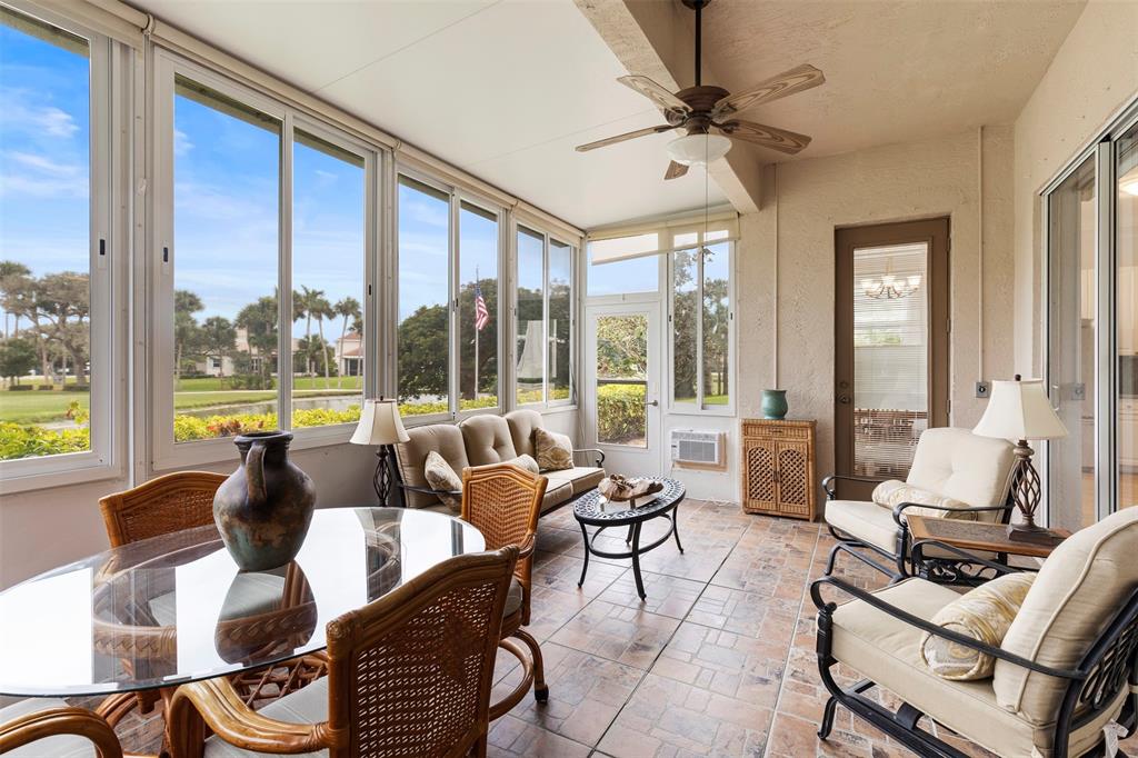11 Winghaven Lane Fort Pierce, FL 34949 - Photo 26 of 50 a living room with furniture and floor to ceiling windows