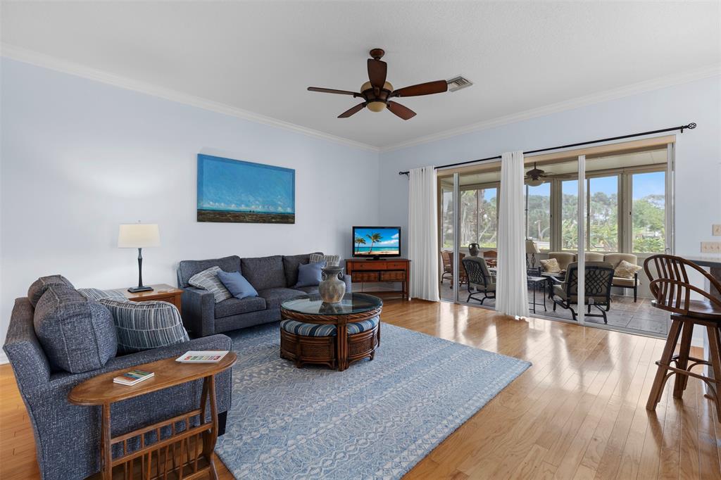 11 Winghaven Lane Fort Pierce, FL 34949 - Photo 6 of 50 a living room with furniture and a flat screen tv with wooden floor
