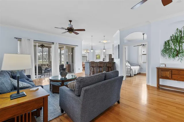 a living room with furniture a rug and a flat screen tv
