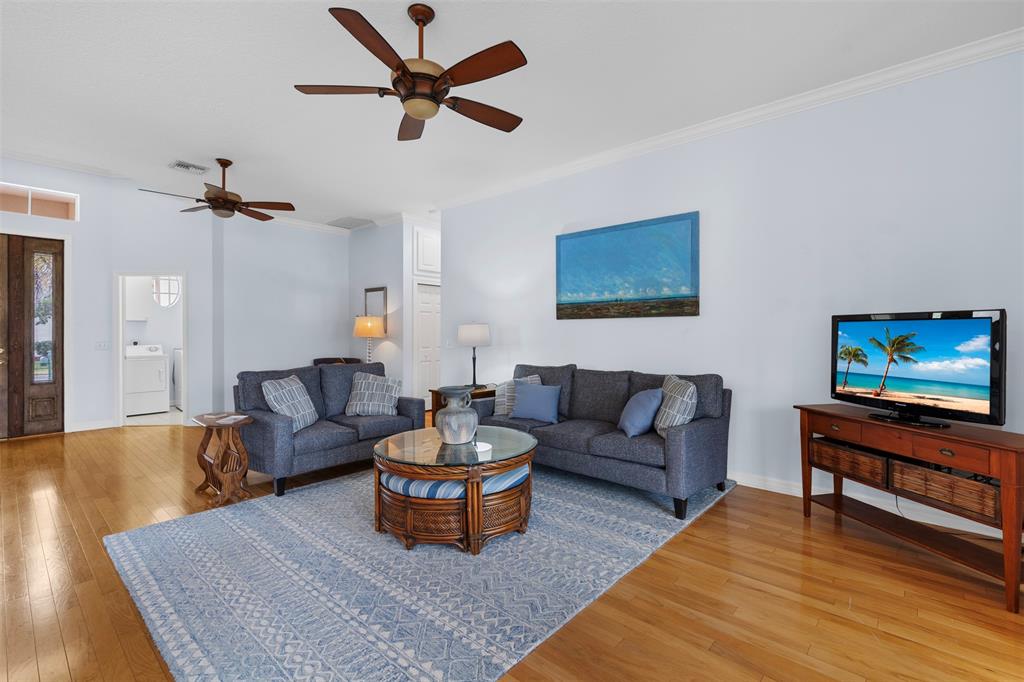 11 Winghaven Lane Fort Pierce, FL 34949 - Photo 8 of 50 a living room with furniture a rug and a flat screen tv